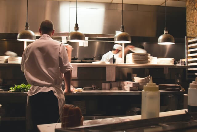 chef standing in Indian Restaurants kitchen